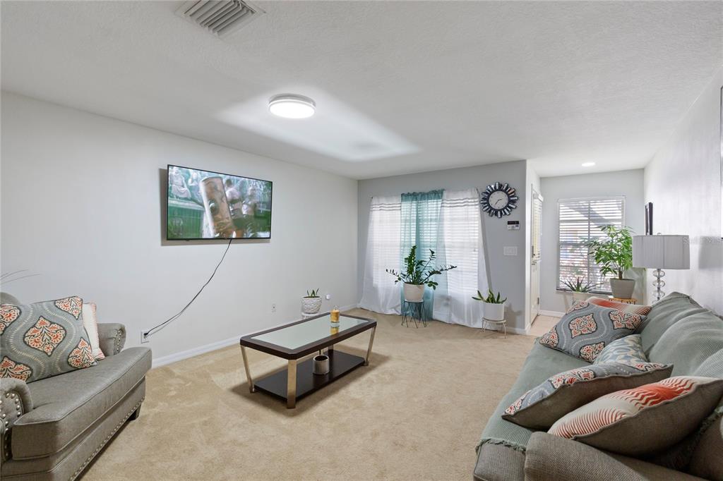 10901 Brickside Court Riverview, FL 33579 - Photo 5 of 36 a living room with furniture and a couch