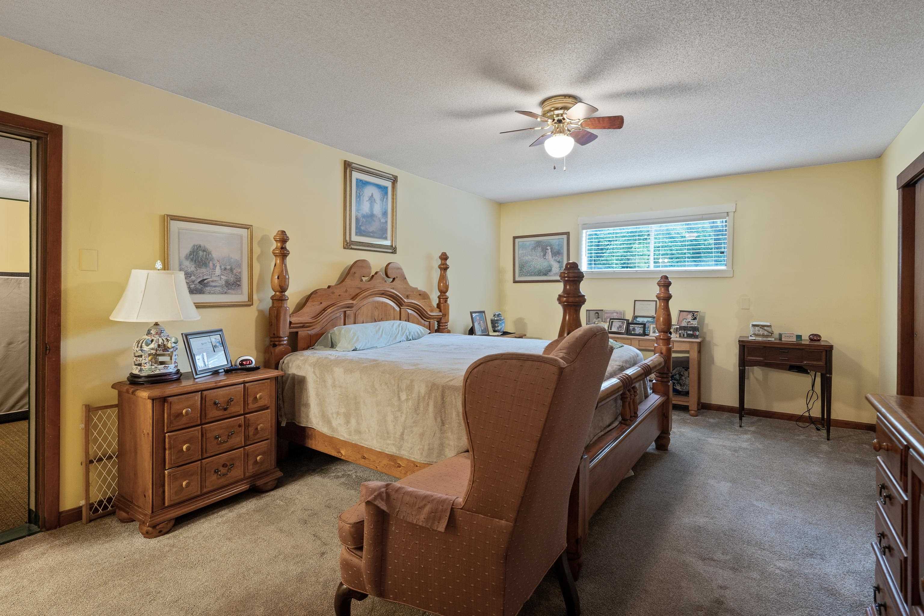 9252 Brunswick Road Millington, TN 38053 - Photo 20 of 40 a bed room with a bed and a chandelier