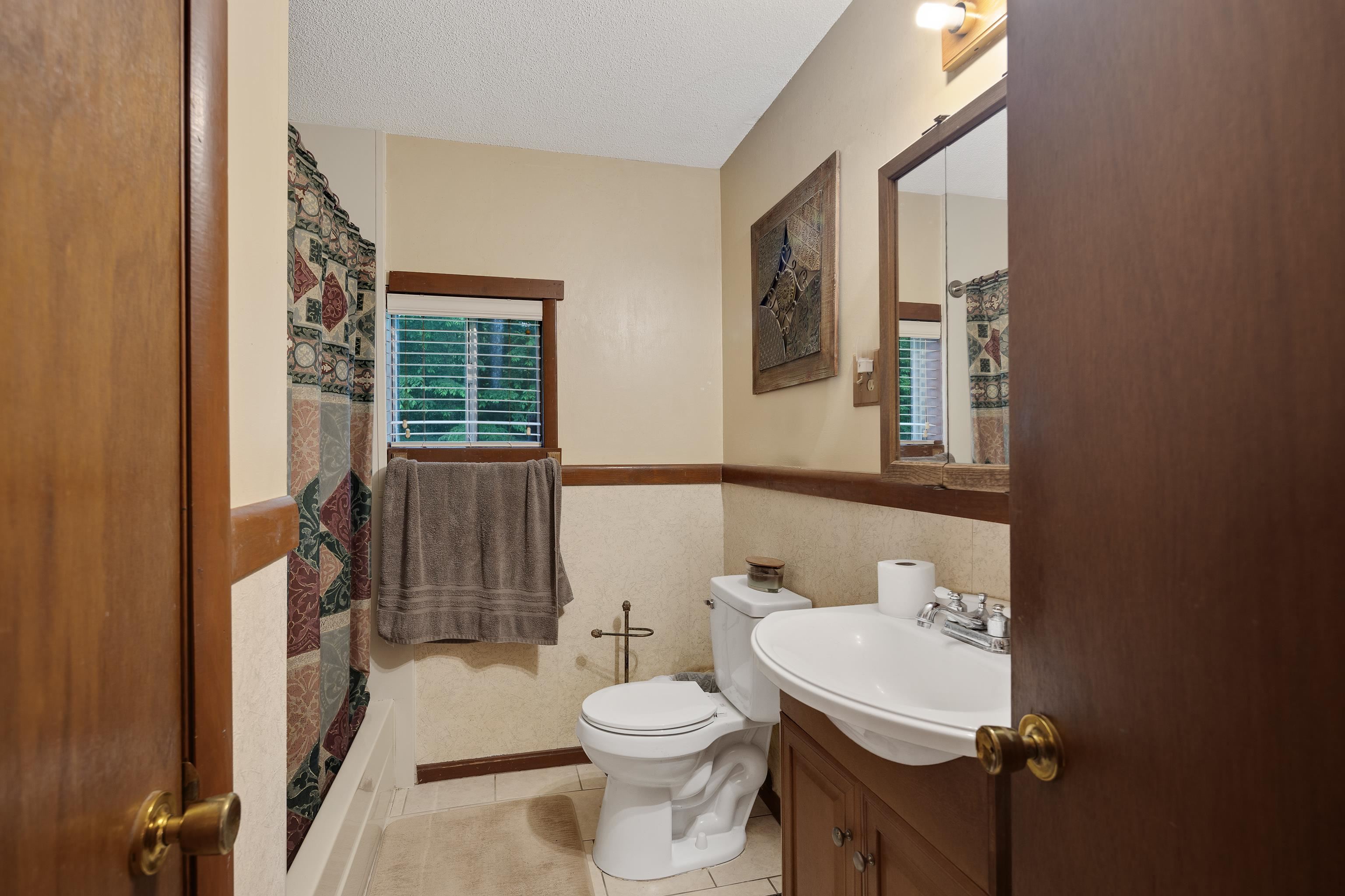 9252 Brunswick Road Millington, TN 38053 - Photo 24 of 40 a bathroom with a sink a toilet and shower