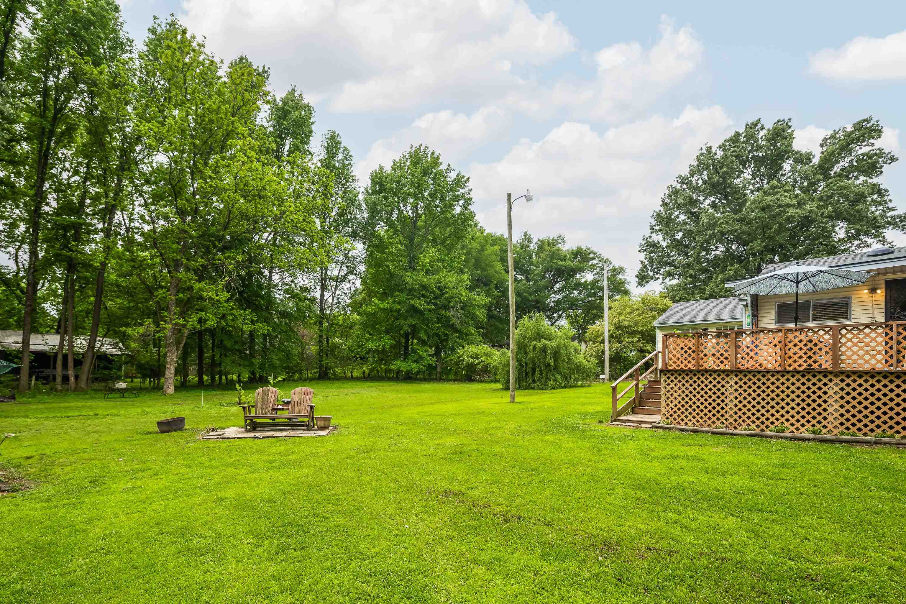 9252 Brunswick Road Millington, TN 38053 - Photo 32 of 40 a view of a backyard with a small cabin