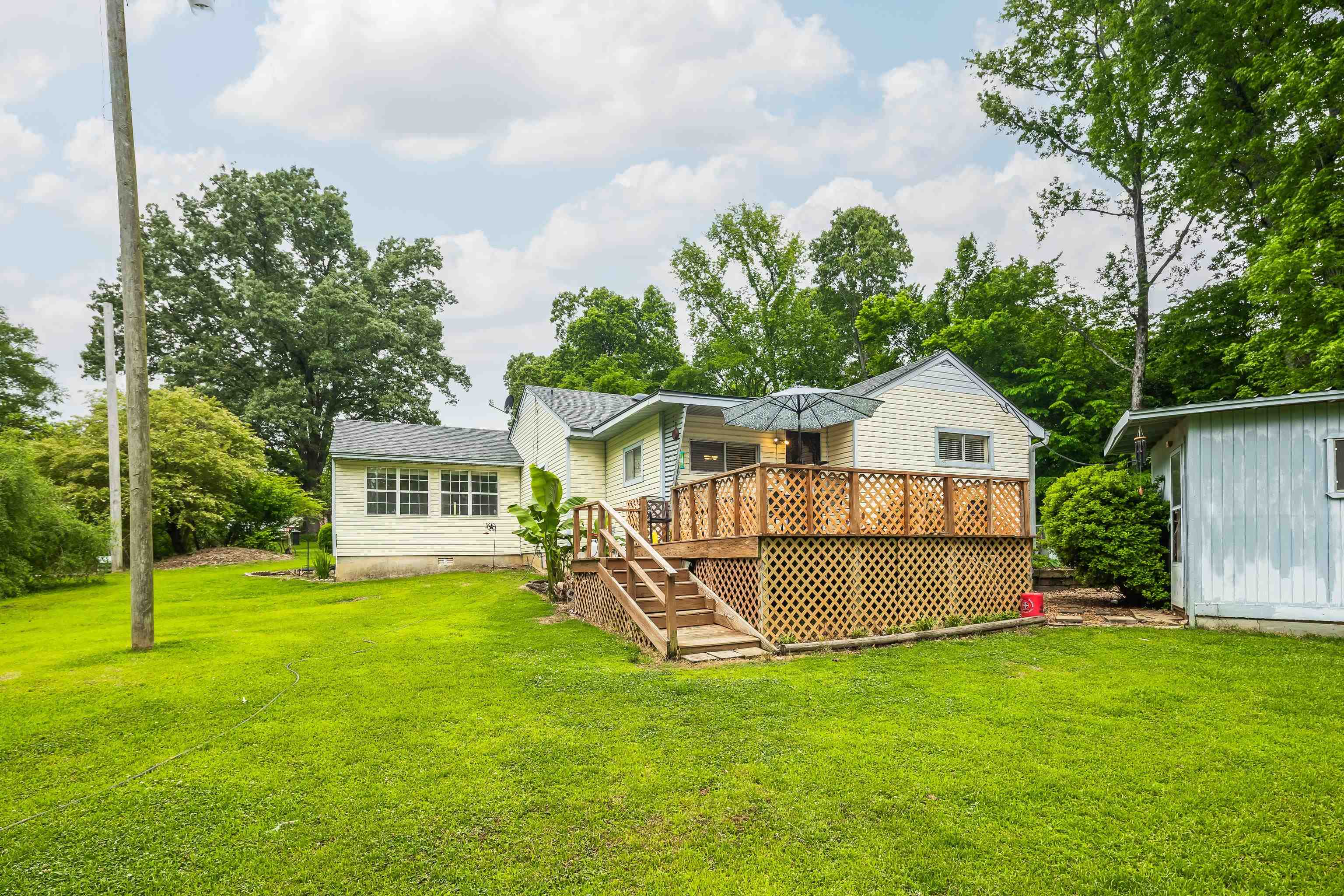 9252 Brunswick Road Millington, TN 38053 - Photo 33 of 40 a view of a house with a yard and a garden
