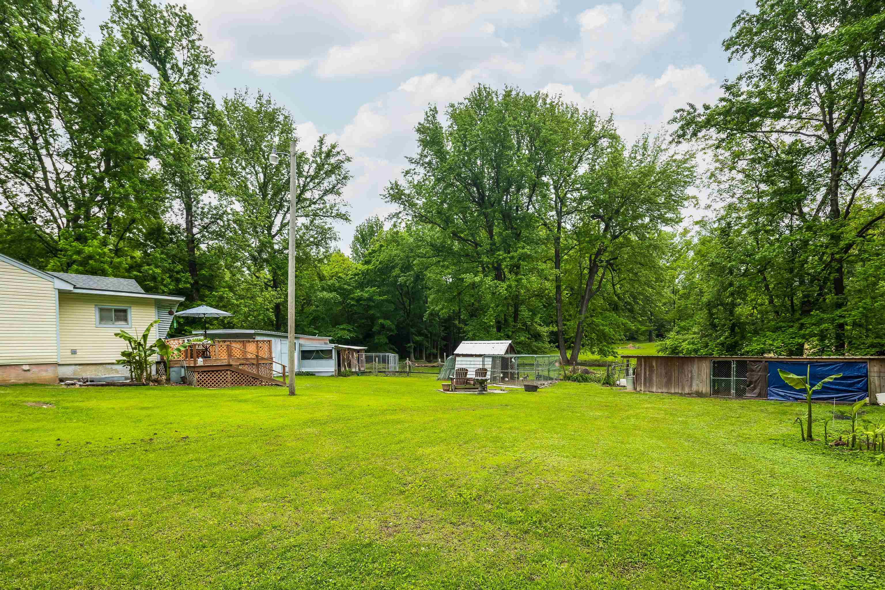 9252 Brunswick Road Millington, TN 38053 - Photo 36 of 40 a view of a house with a big yard and sitting area