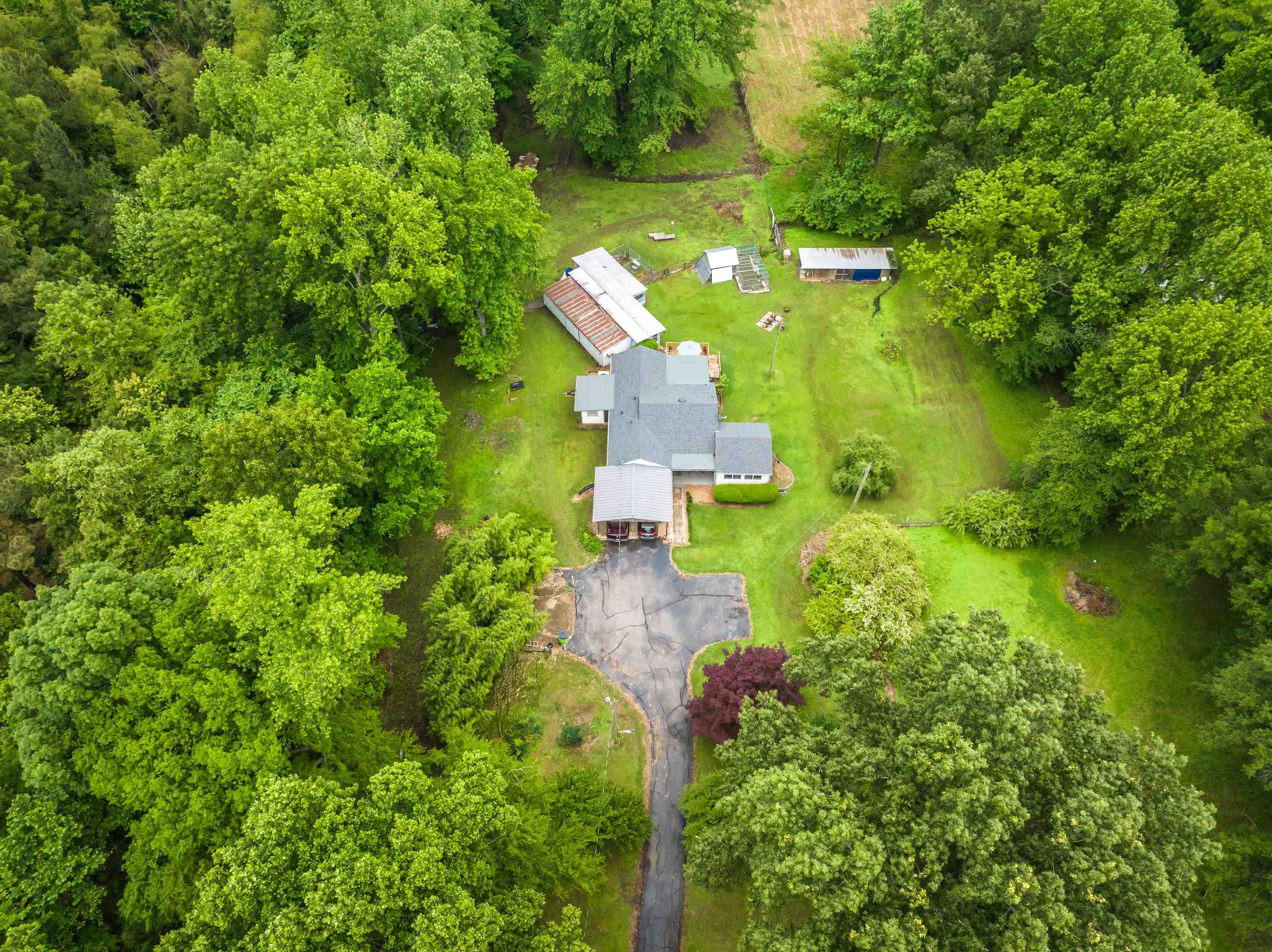 9252 Brunswick Road Millington, TN 38053 - Photo 4 of 40 an aerial view of a house with a yard basket ball court and outdoor seating