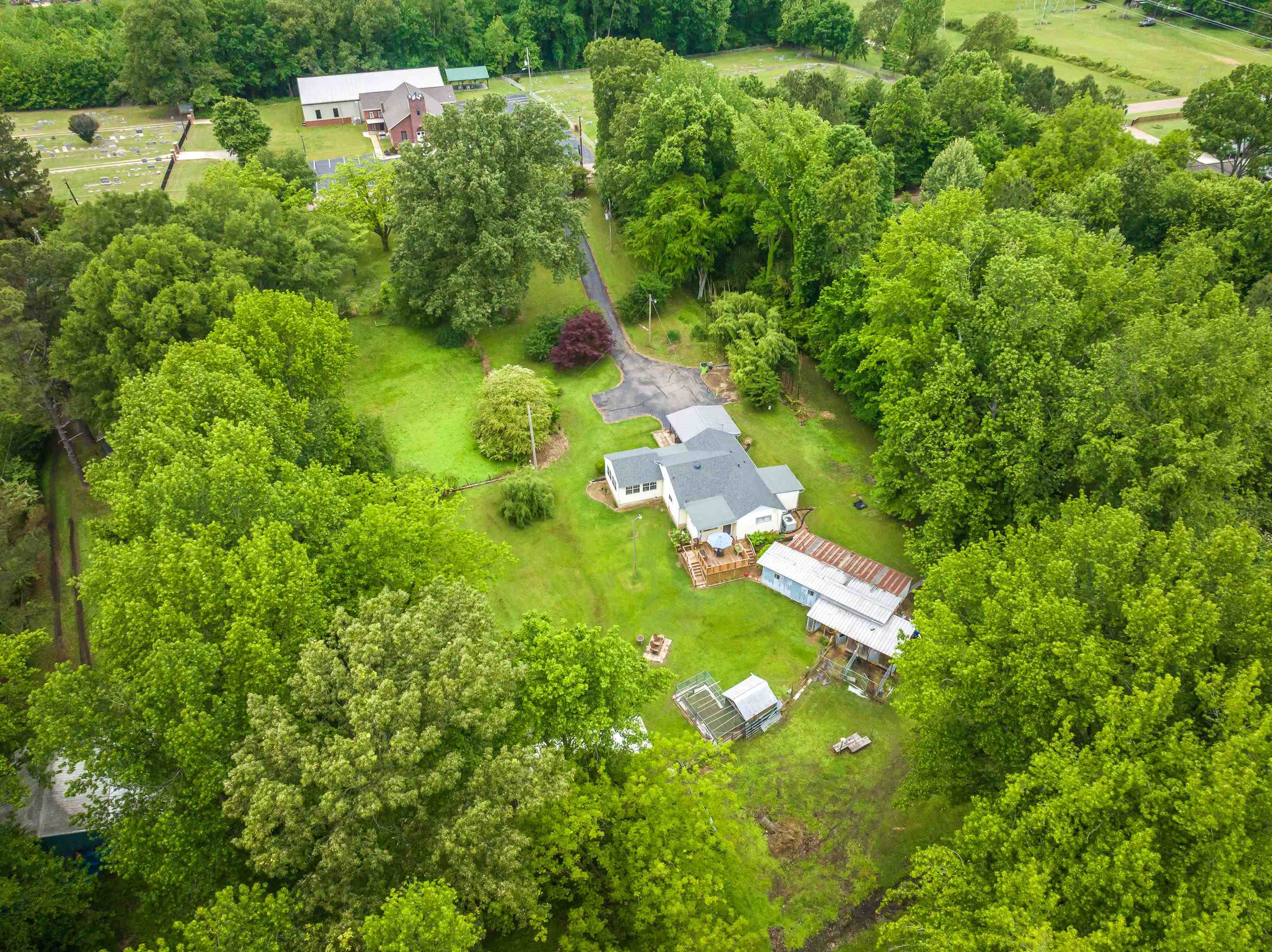 9252 Brunswick Road Millington, TN 38053 - Photo 6 of 40 a view of a yard with yellow house