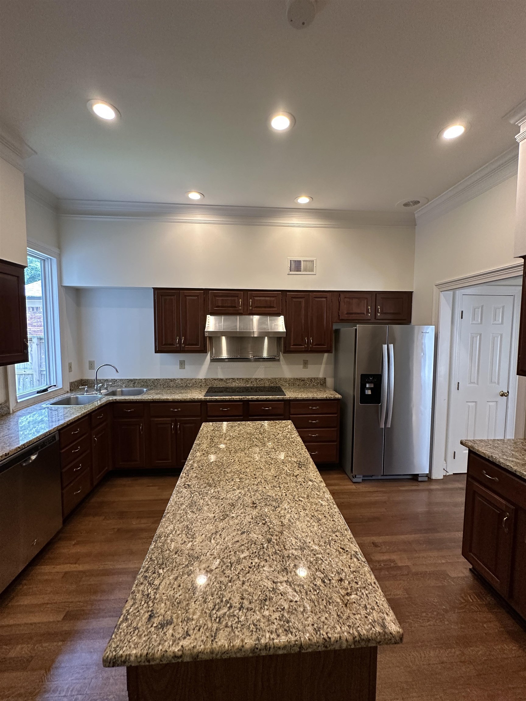 320 River Oaks Road North Memphis, TN 38120 - Photo 12 of 21 a kitchen with stainless steel appliances granite countertop a refrigerator and a sink