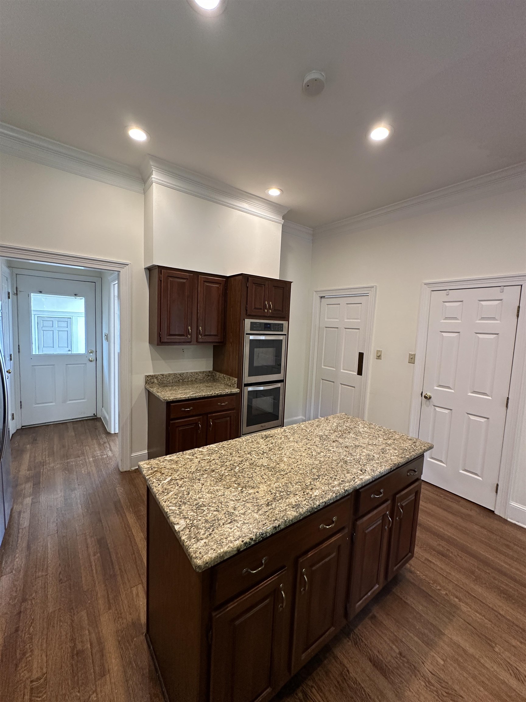 320 River Oaks Road North Memphis, TN 38120 - Photo 13 of 21 a kitchen with a wooden floor and electric appliances