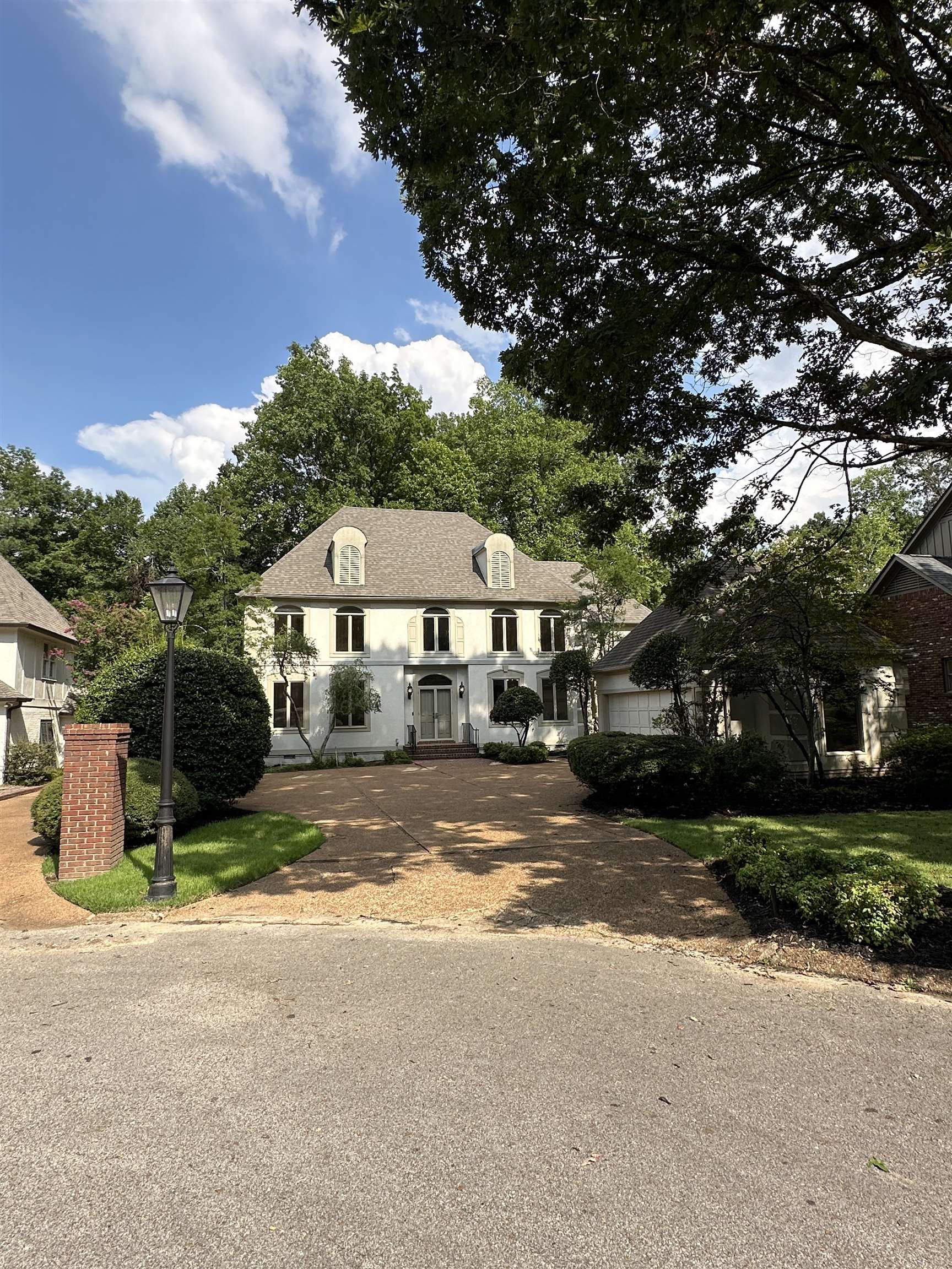 320 River Oaks Road North Memphis, TN 38120 - Photo 2 of 21 a view of a house with a yard and large tree