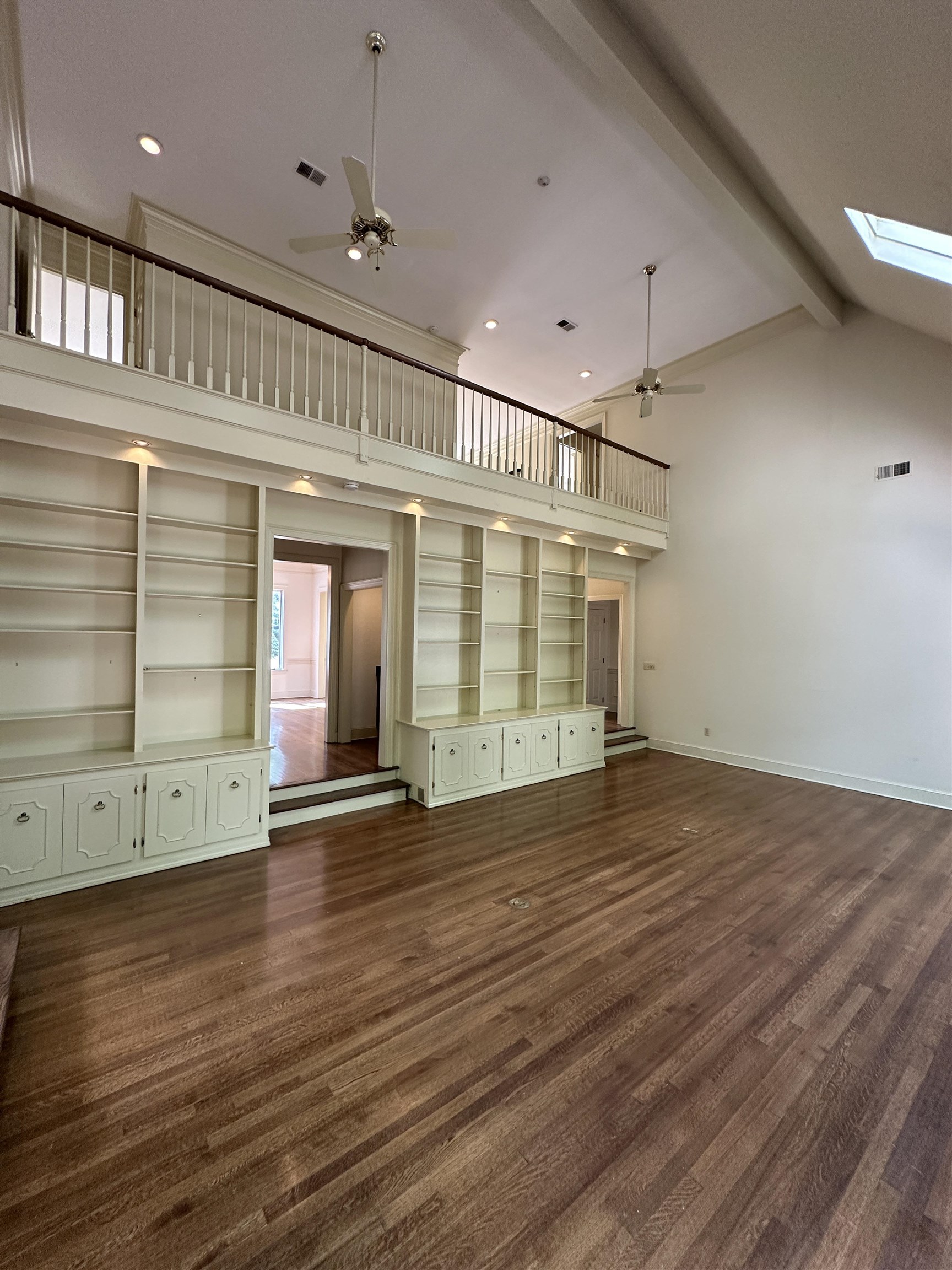 320 River Oaks Road North Memphis, TN 38120 - Photo 3 of 21 an empty room with wooden floor and windows