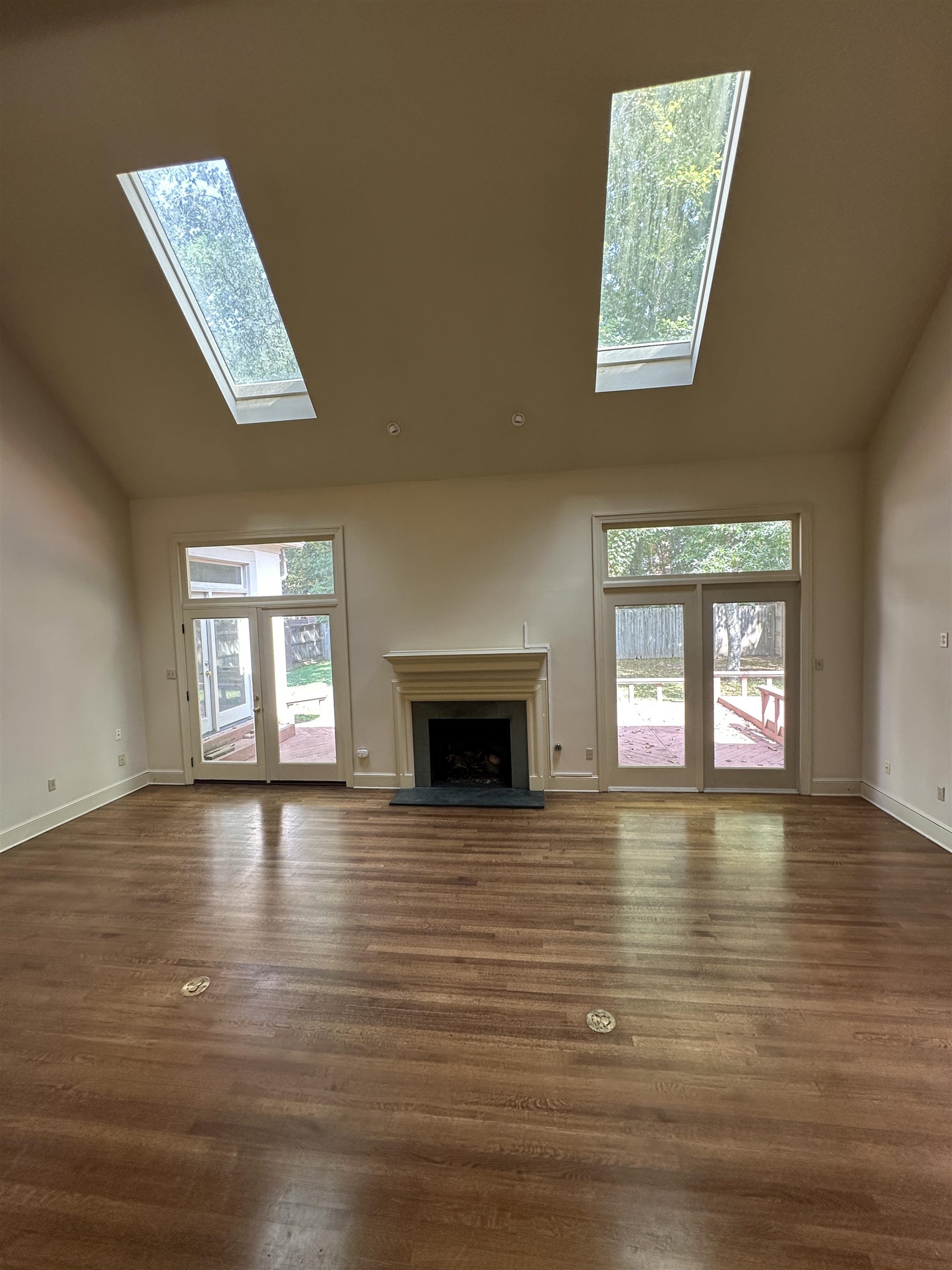 320 River Oaks Road North Memphis, TN 38120 - Photo 4 of 21 an empty room with windows and fireplace
