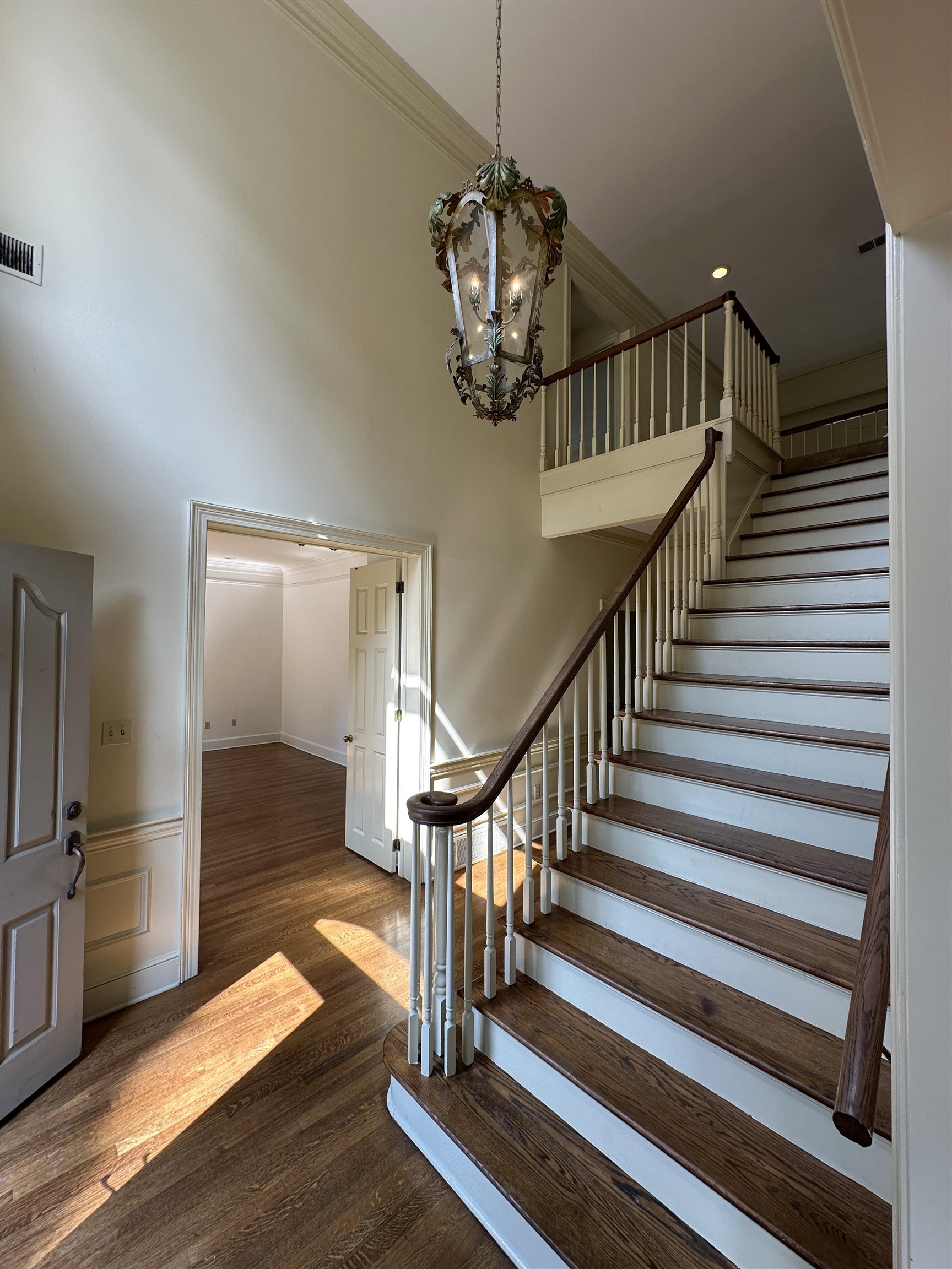 320 River Oaks Road North Memphis, TN 38120 - Photo 7 of 21 a view of a hallway with wooden floor and stairs