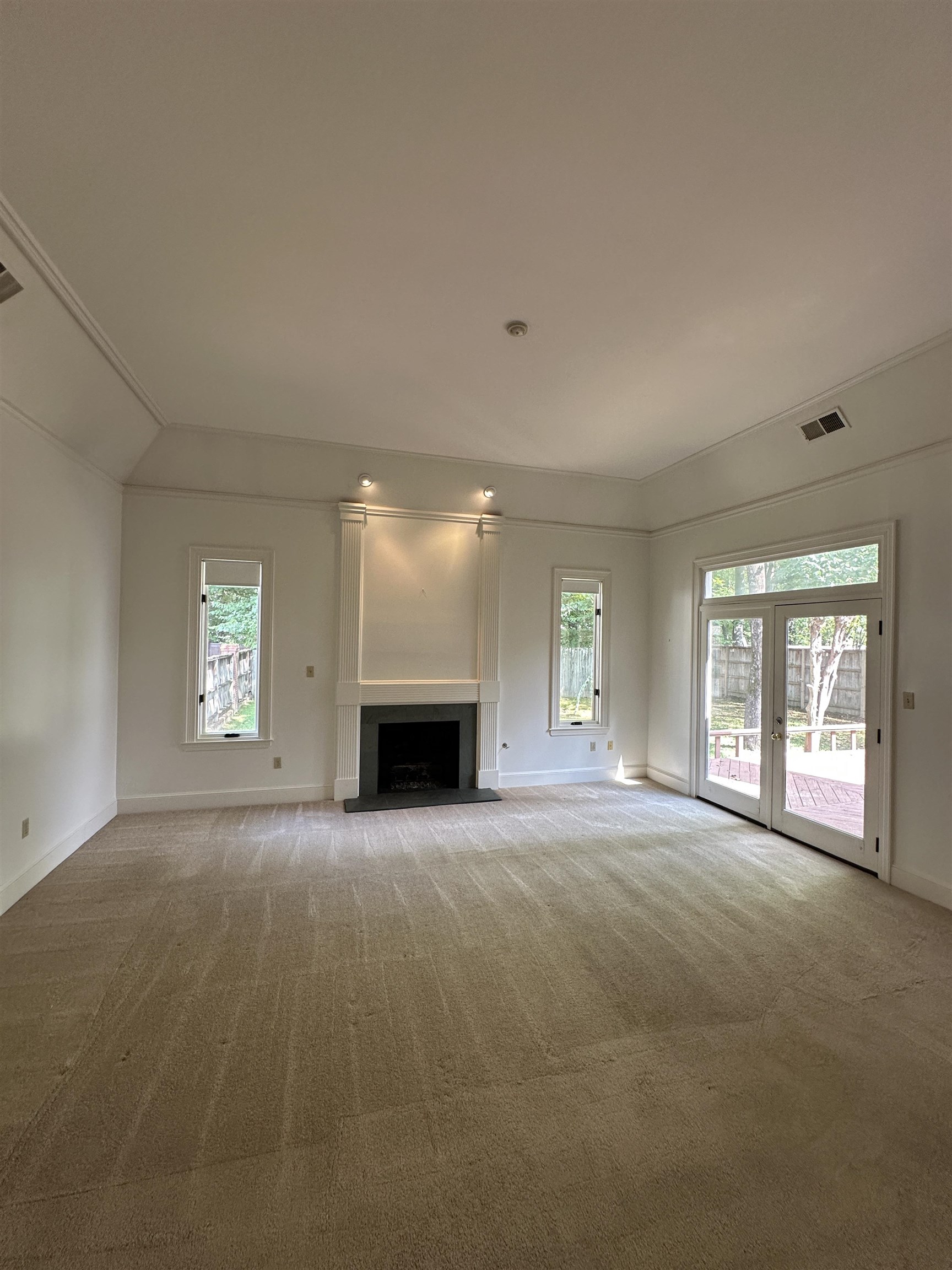 320 River Oaks Road North Memphis, TN 38120 - Photo 9 of 21 an empty room with windows and fireplace