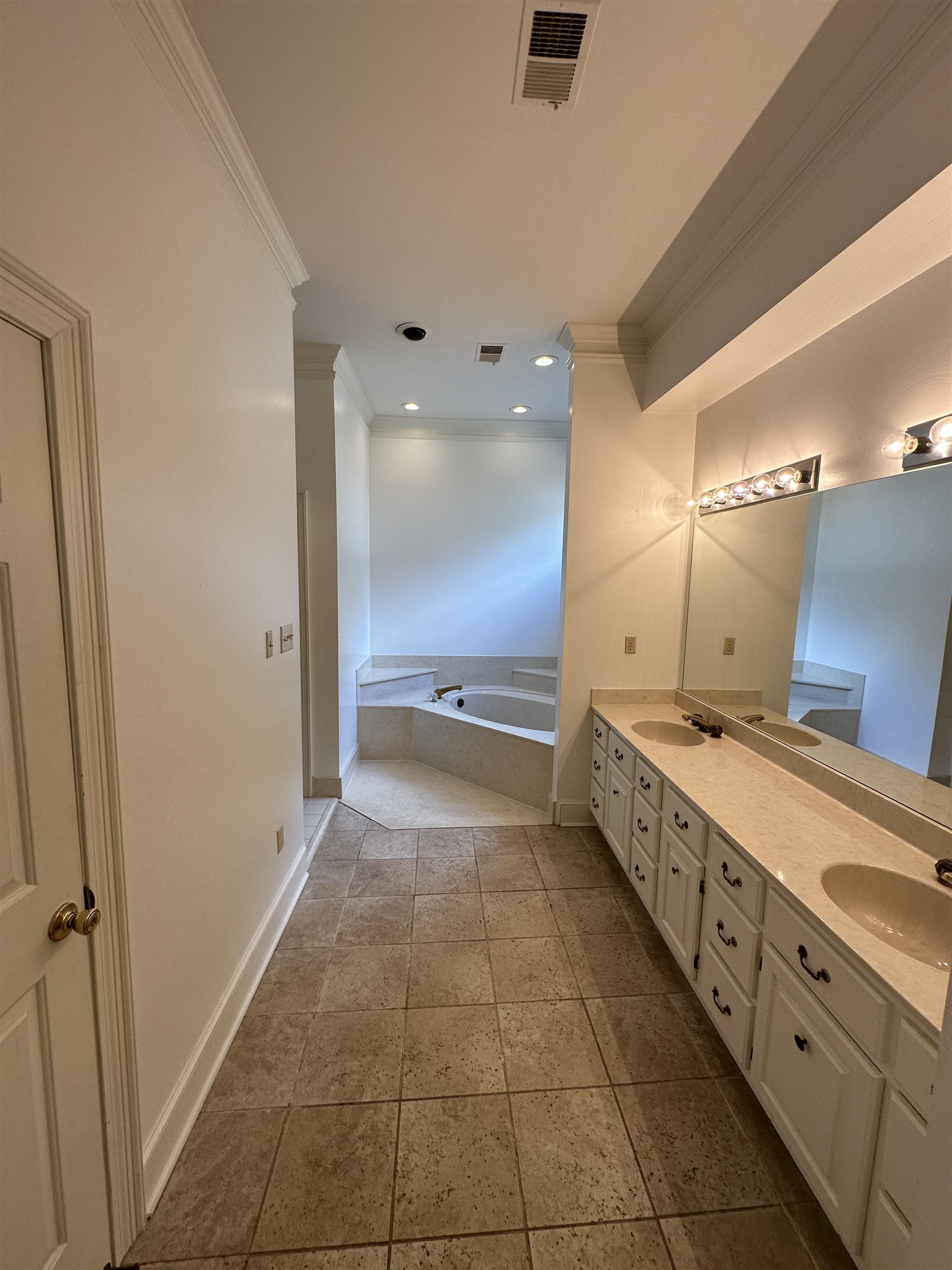 320 River Oaks Road North Memphis, TN 38120 - Photo 10 of 21 a bathroom with a mirror and a double vanity sink