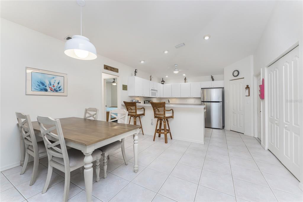 443 Rotonda Circle Rotonda West, FL 33947 - Photo 14 of 59 a kitchen with a table and chairs in it