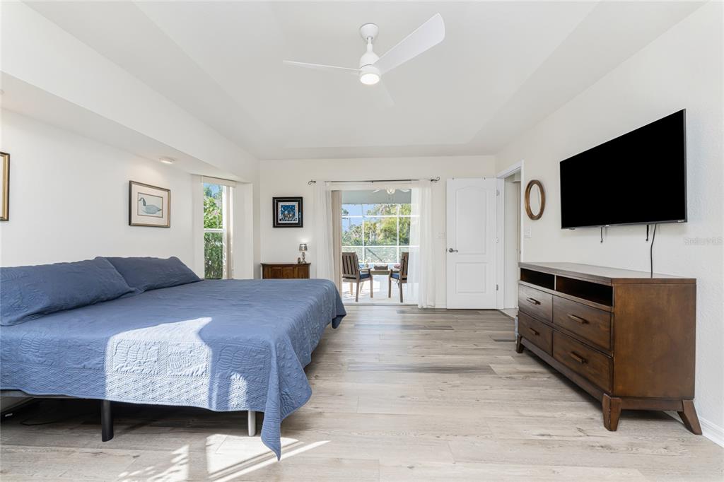443 Rotonda Circle Rotonda West, FL 33947 - Photo 21 of 59 a living room with furniture and a flat screen tv