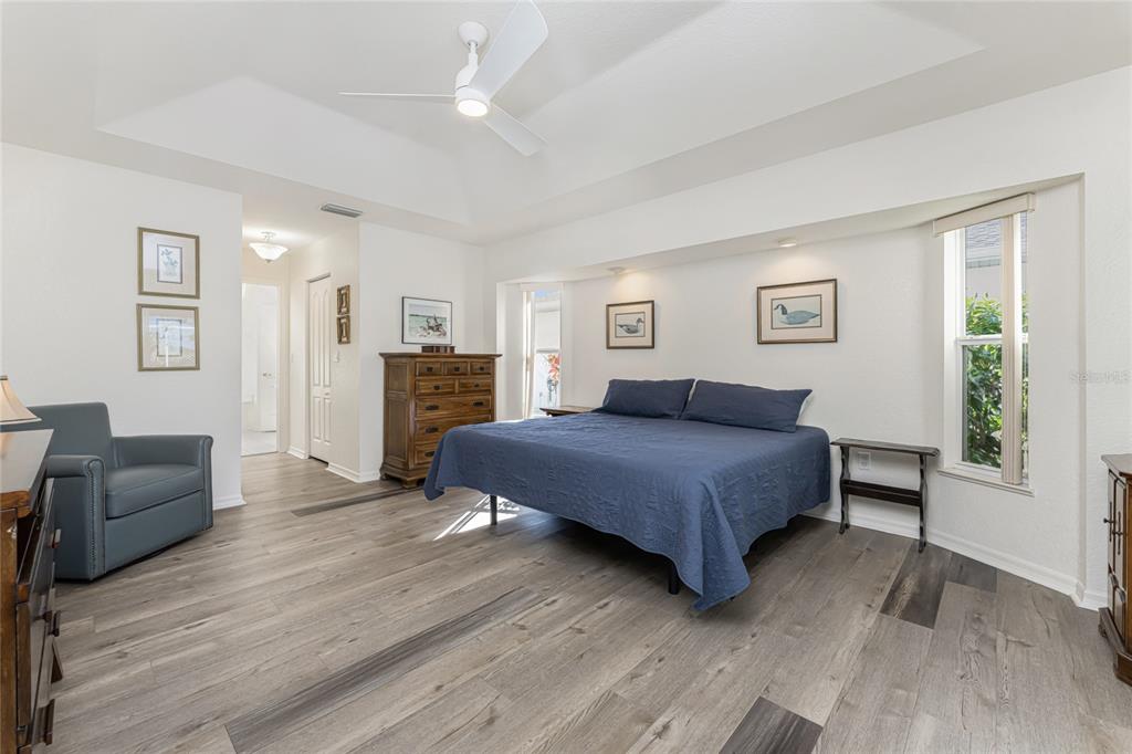 443 Rotonda Circle Rotonda West, FL 33947 - Photo 22 of 59 a bedroom with a bed and a couch