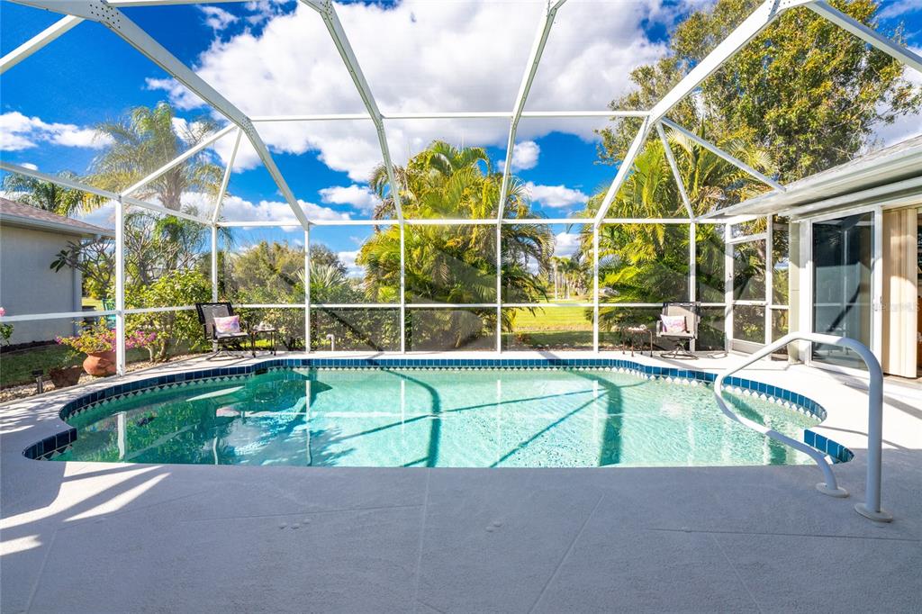 443 Rotonda Circle Rotonda West, FL 33947 - Photo 3 of 59 a view of a swimming pool with a patio