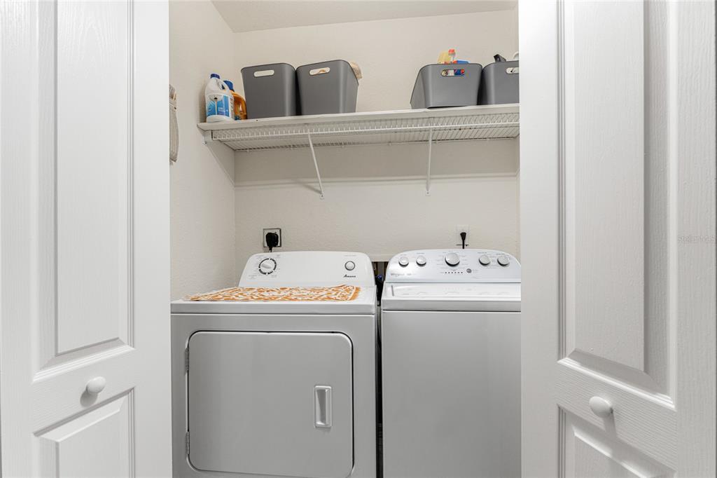 443 Rotonda Circle Rotonda West, FL 33947 - Photo 35 of 59 a utility room with dryer and washer