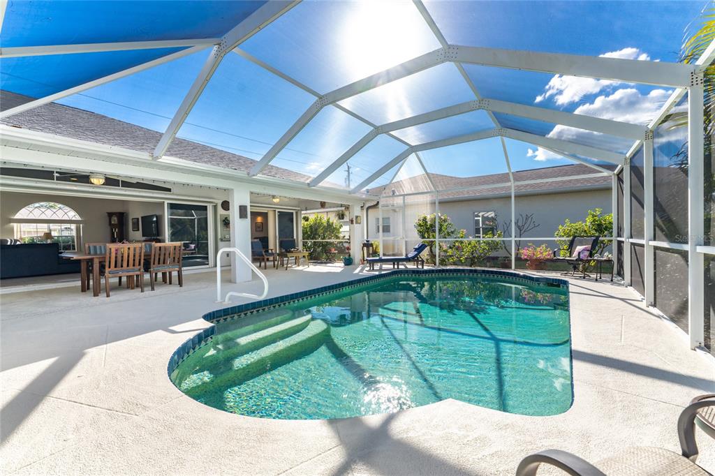 443 Rotonda Circle Rotonda West, FL 33947 - Photo 39 of 59 a view of a swimming pool with chairs