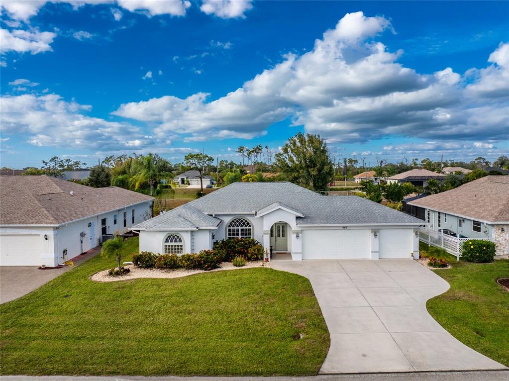 443 Rotonda Circle Rotonda West, FL 33947 - Photo 51 of 59 a aerial view of a house with a yard