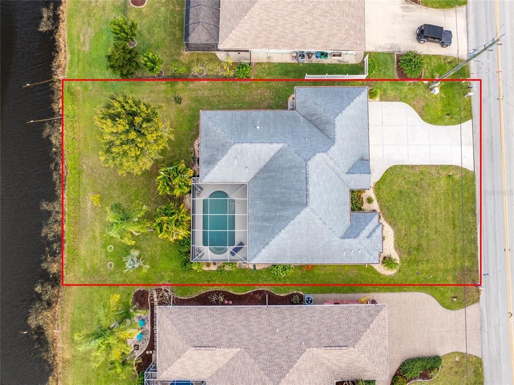 443 Rotonda Circle Rotonda West, FL 33947 - Photo 59 of 59 an aerial view of a house with a swimming pool