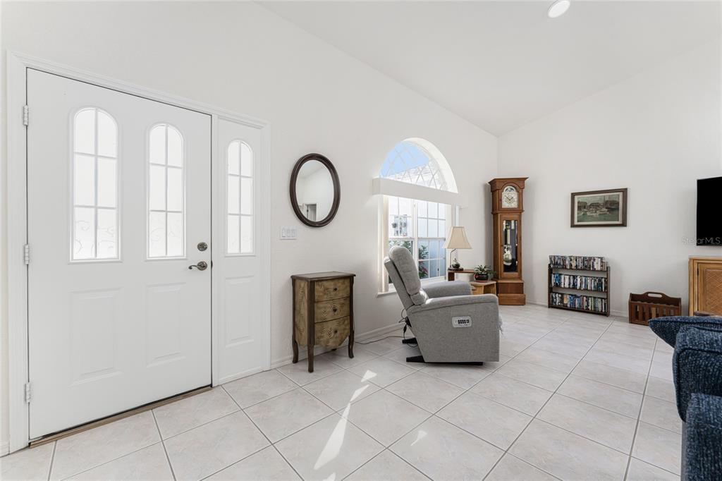 443 Rotonda Circle Rotonda West, FL 33947 - Photo 9 of 59 a living room with furniture and a large window