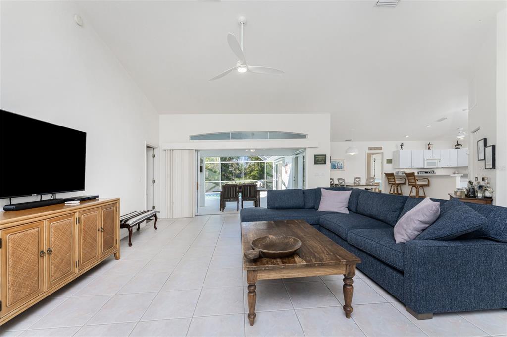 443 Rotonda Circle Rotonda West, FL 33947 - Photo 10 of 59 a living room with furniture and a flat screen tv
