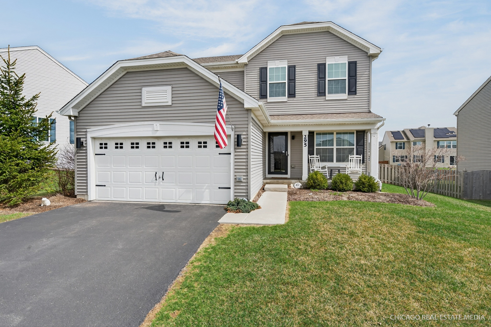 295 Monarch Lane Volo, IL 60020 - Photo 1 of 36 a view of white house with a yard and table and chairs