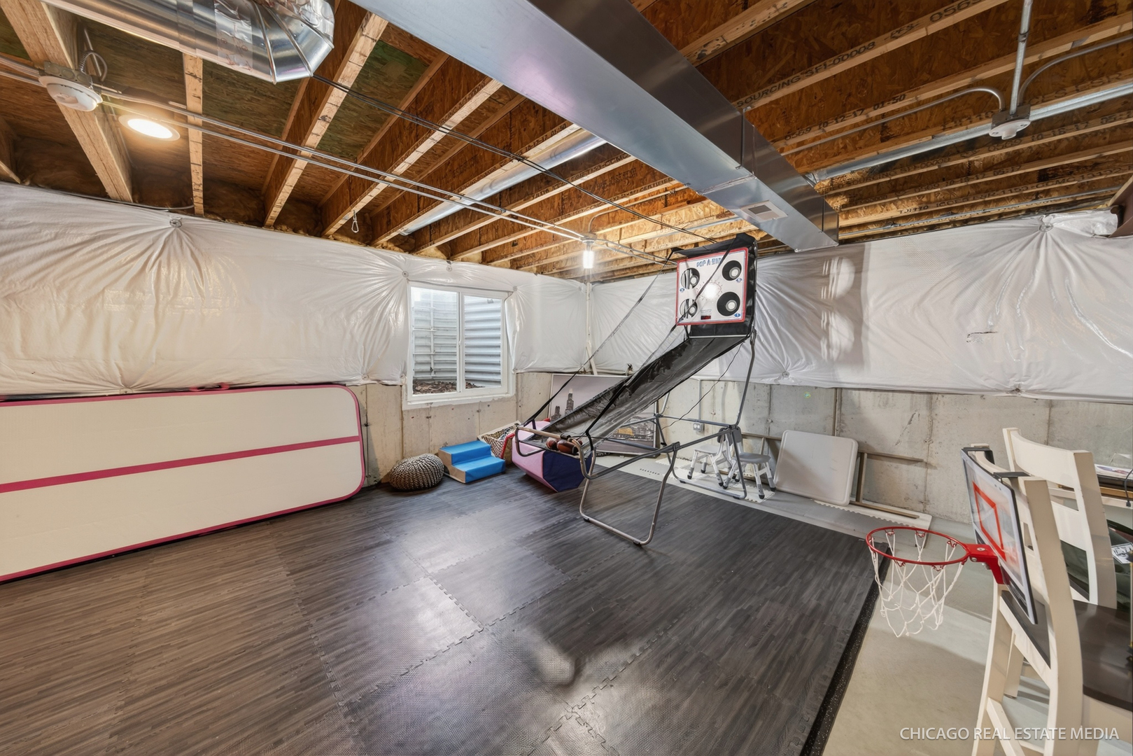 295 Monarch Lane Volo, IL 60020 - Photo 25 of 36 a view of a room with wooden floor and stairs