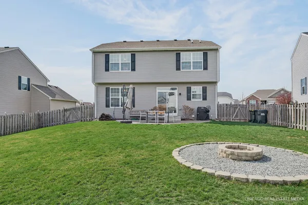 a view of a patio with a yard