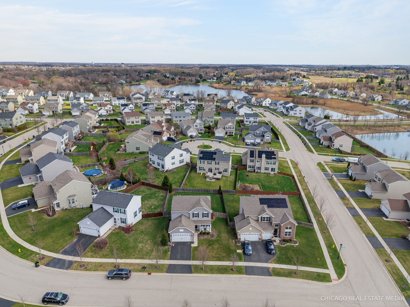 295 Monarch Lane Volo, IL 60020 - Photo 33 of 36 an aerial view of residential houses with outdoor space and parking