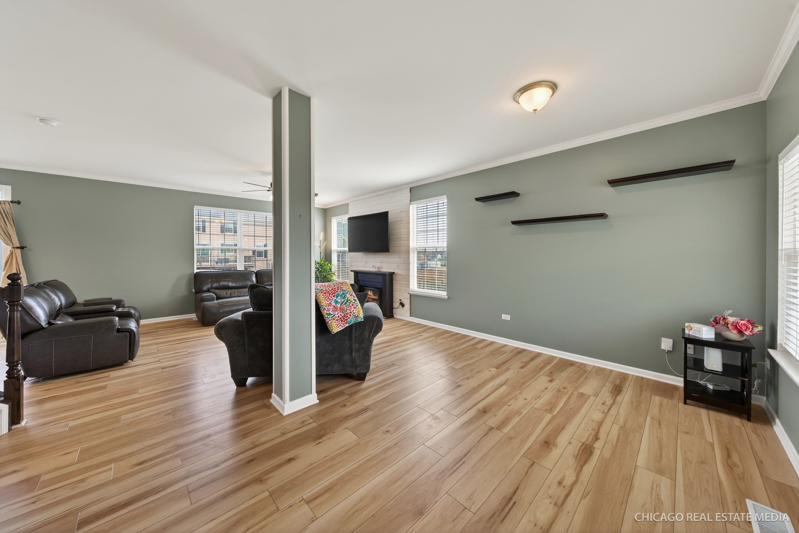295 Monarch Lane Volo, IL 60020 - Photo 4 of 36 a living room with furniture and a wooden floor
