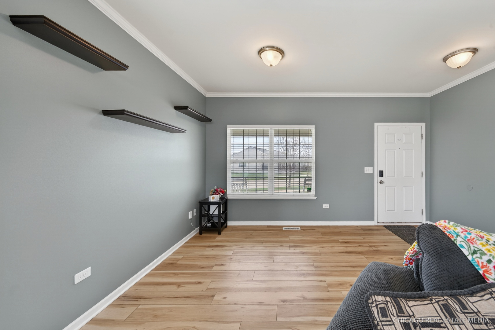 295 Monarch Lane Volo, IL 60020 - Photo 5 of 36 a view of a room with window and wooden floor