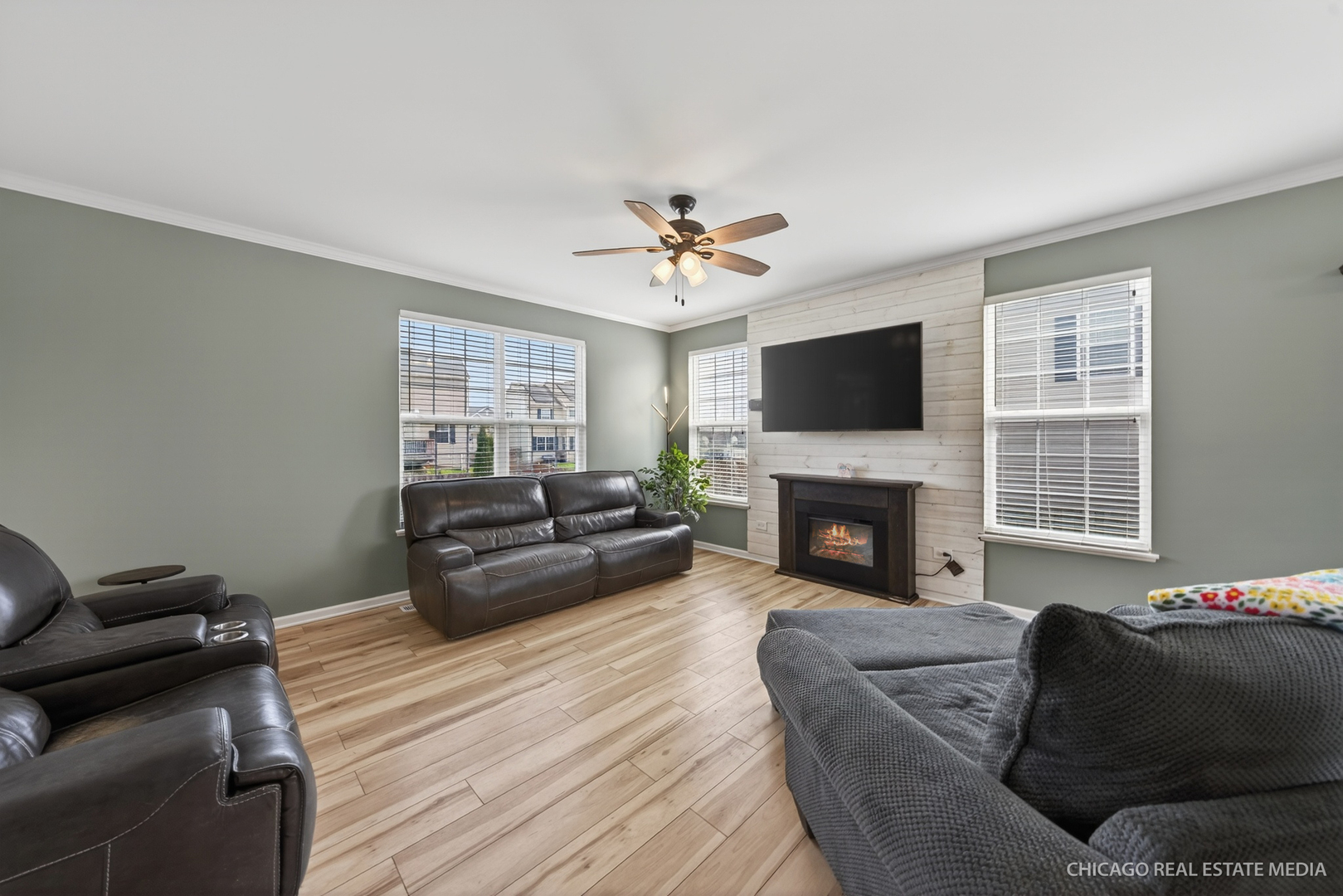 295 Monarch Lane Volo, IL 60020 - Photo 6 of 36 a living room with furniture a fireplace and a flat screen tv