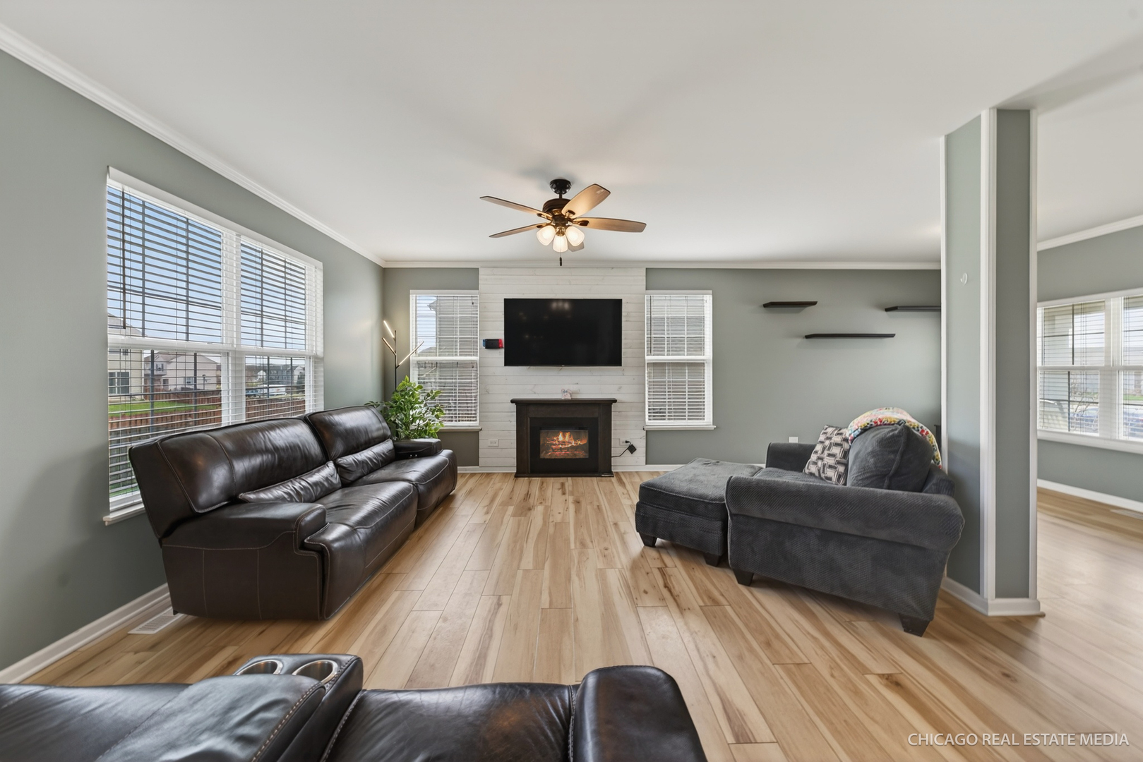 295 Monarch Lane Volo, IL 60020 - Photo 7 of 36 a living room with furniture and a fireplace