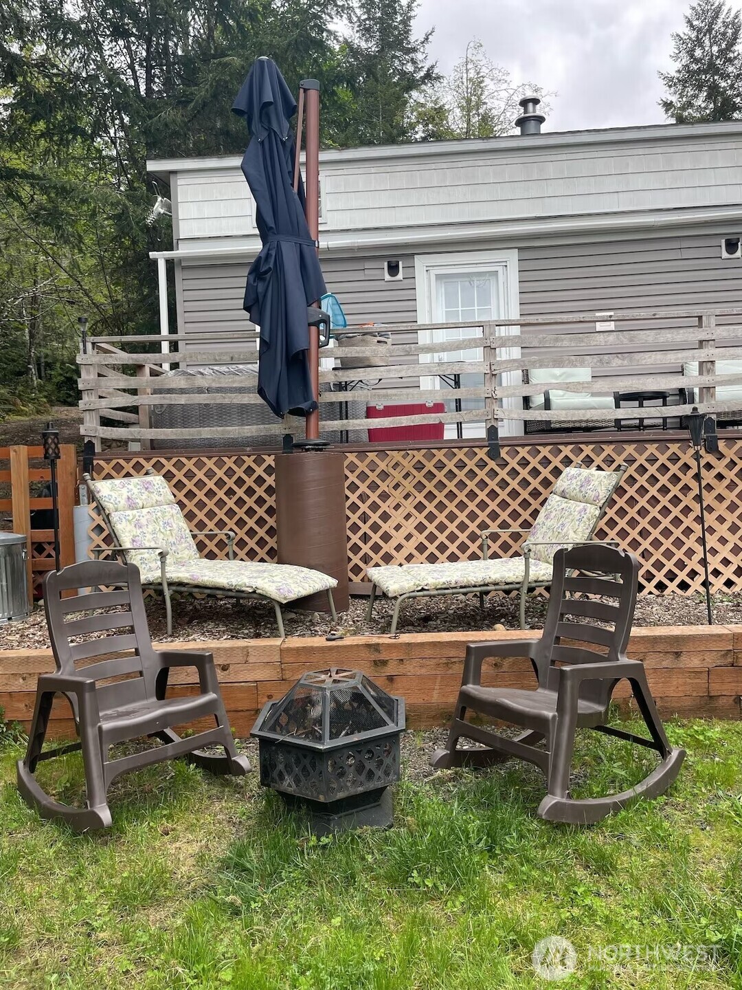 50 North Rustic Ridge Drive Lilliwaup, WA 98555 - Photo 20 of 40 a view of a patio with a table and chairs