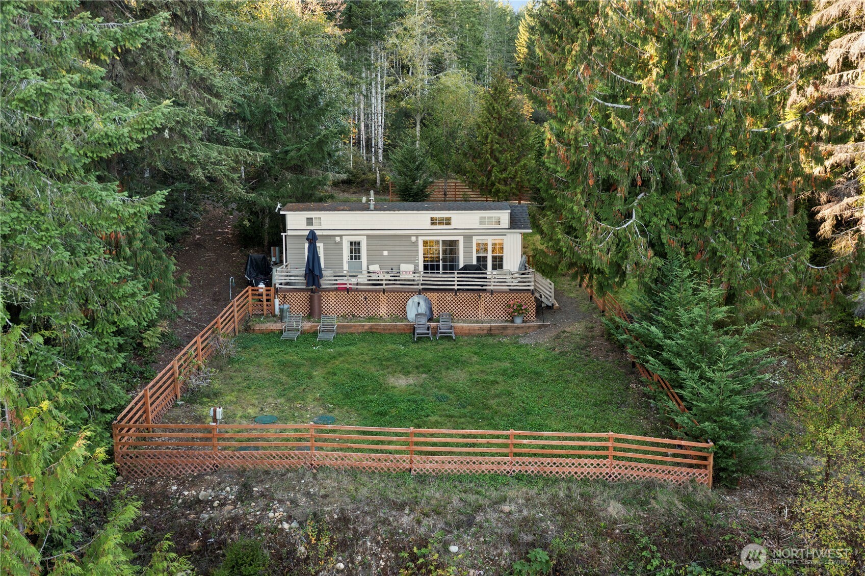 50 North Rustic Ridge Drive Lilliwaup, WA 98555 - Photo 2 of 40 a view of a house with a backyard