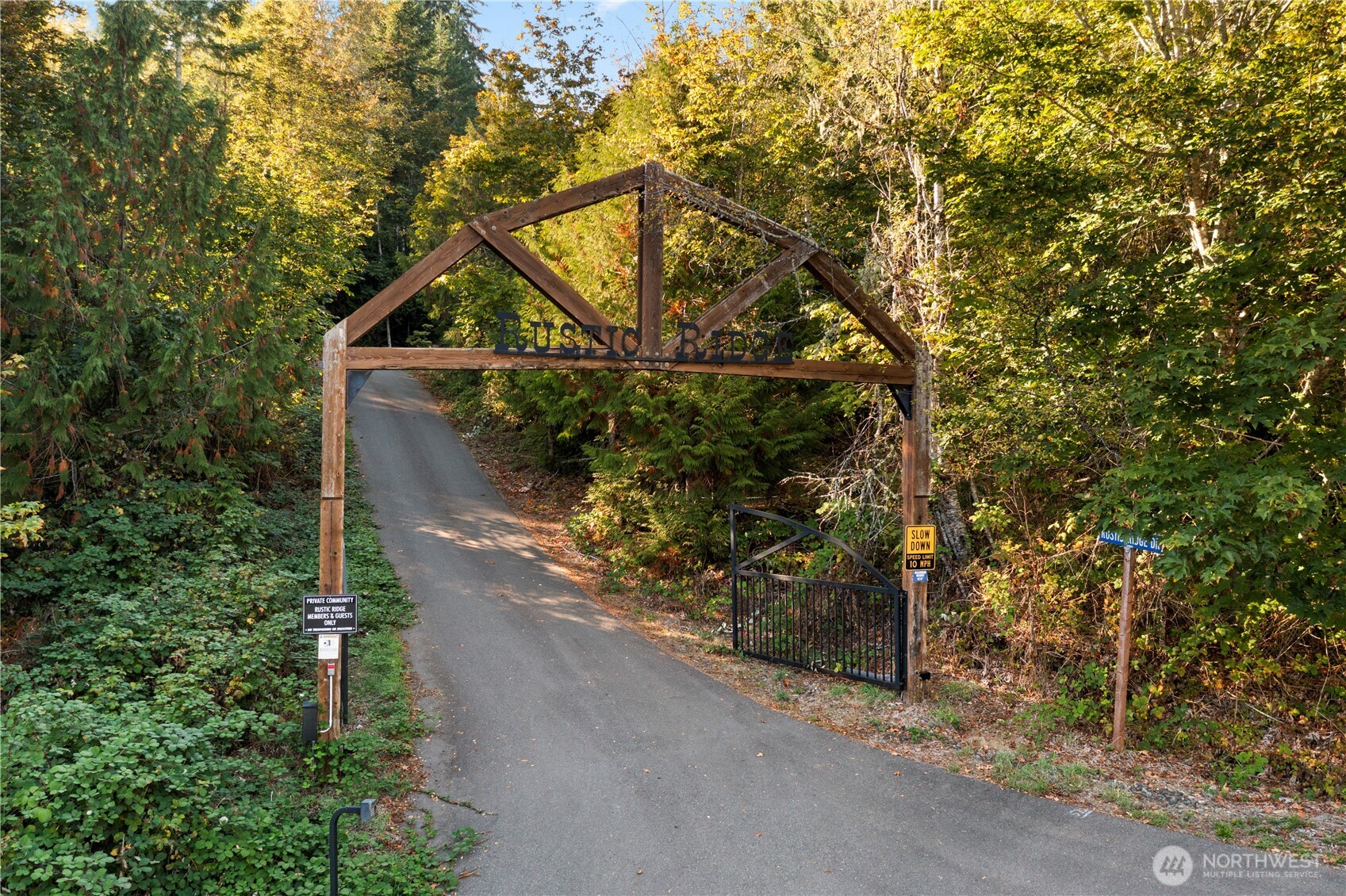 50 North Rustic Ridge Drive Lilliwaup, WA 98555 - Photo 40 of 40 a backyard of a house with lots of green space