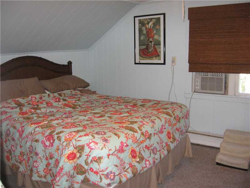 22 Babcock Road Westerly, RI 02891 - Photo 8 of 12 Bedroom. Second floor bedroom in the smaller apartment has a surprisingly spacious closet for an older home.