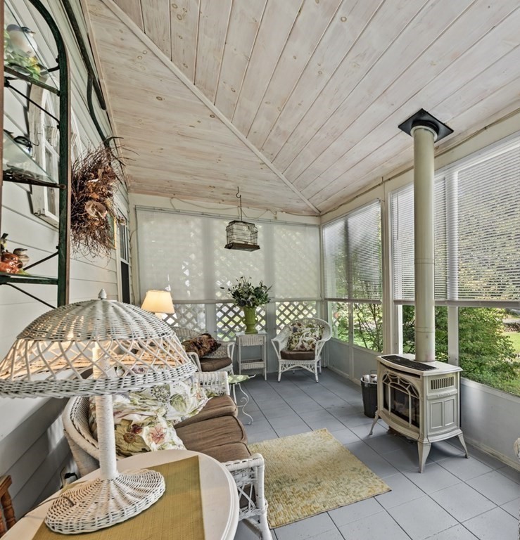 42 Willow Street Reading, MA 01867 - Photo 13 of 35 a living room with furniture and a table