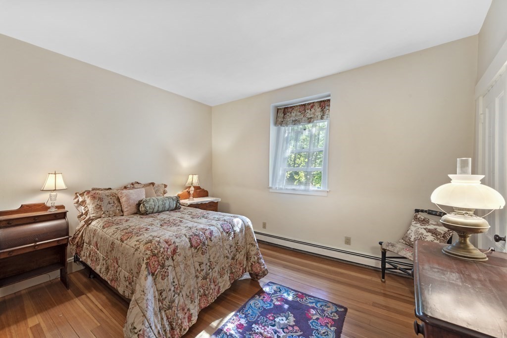 42 Willow Street Reading, MA 01867 - Photo 16 of 35 a bedroom with two beds and a table