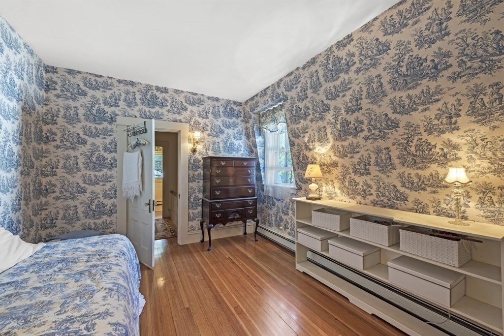 42 Willow Street Reading, MA 01867 - Photo 18 of 35 a living room with furniture and a wooden floor