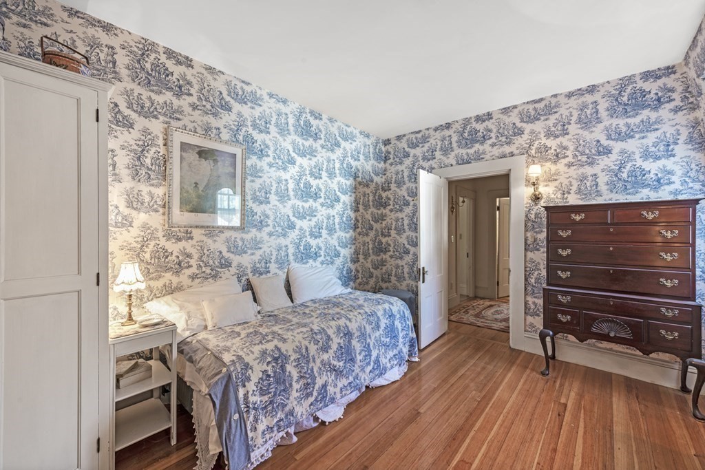 42 Willow Street Reading, MA 01867 - Photo 19 of 35 a bedroom with a bed and a dresser