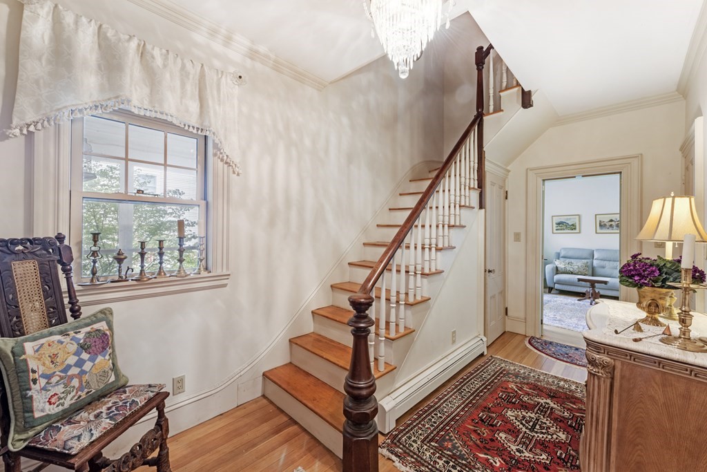 42 Willow Street Reading, MA 01867 - Photo 2 of 35 a view of an entryway with wooden floor and windows