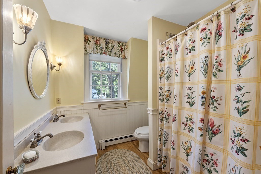 42 Willow Street Reading, MA 01867 - Photo 21 of 35 a bathroom with a sink and a mirror