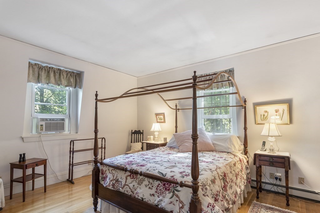 42 Willow Street Reading, MA 01867 - Photo 22 of 35 a bedroom with a bed next to a window