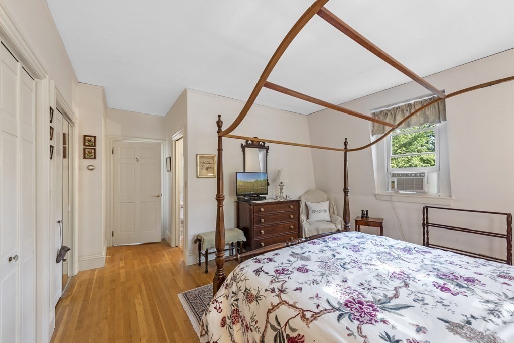 42 Willow Street Reading, MA 01867 - Photo 24 of 35 a bedroom with a bed and a dresser