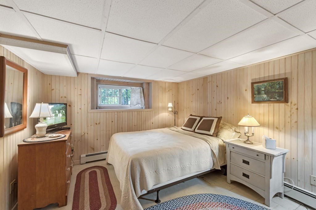 42 Willow Street Reading, MA 01867 - Photo 26 of 35 a bedroom with double bed and a window