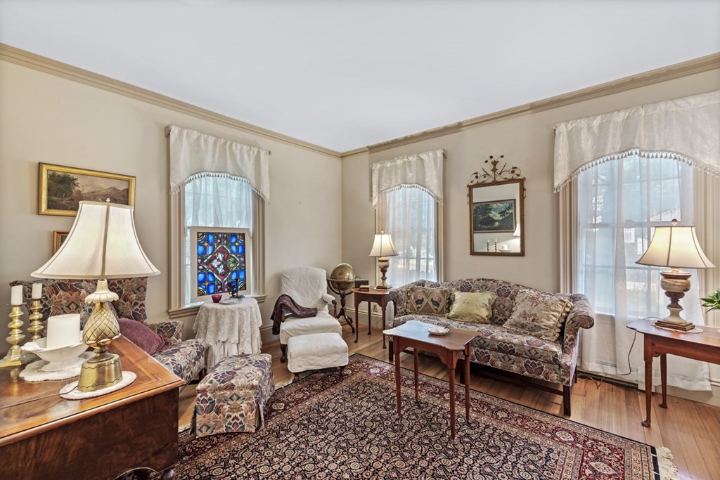 42 Willow Street Reading, MA 01867 - Photo 3 of 35 a living room with furniture and a window