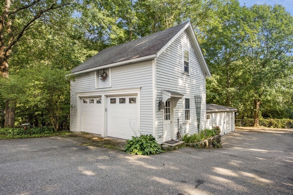 42 Willow Street Reading, MA 01867 - Photo 32 of 35 a view of a house with a yard and plants