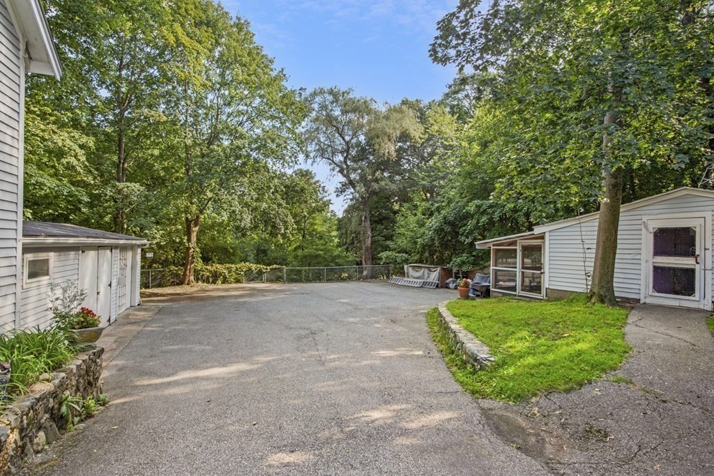 42 Willow Street Reading, MA 01867 - Photo 33 of 35 a view of a backyard with a garden and plants